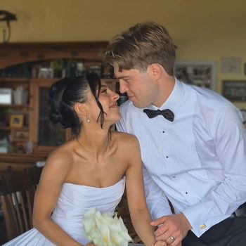 Bride and groom posing for their post-wedding portrait.