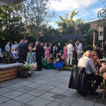 Wedding guests enjoying the celebration at a lively reception