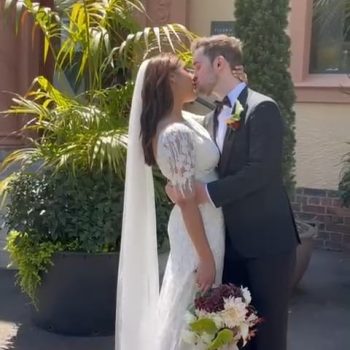 Couple sharing a romantic moment together with soft lighting and an intimate atmosphere.