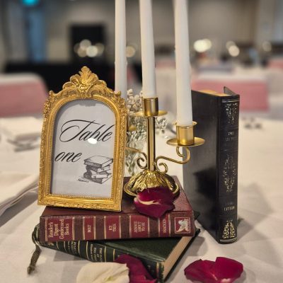 Wedding table number centerpiece with floral decorations and elegant styling